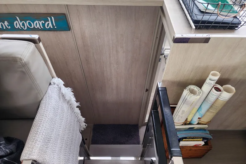 Slide: The Image of Interior of a 2020 Leopard 45 yacht with maps and cozy decor. - 94