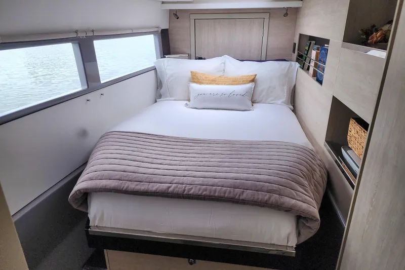 Slide: The Image of Cozy bedroom interior on a 2020 Leopard 45 yacht with a neatly made bed. - 96