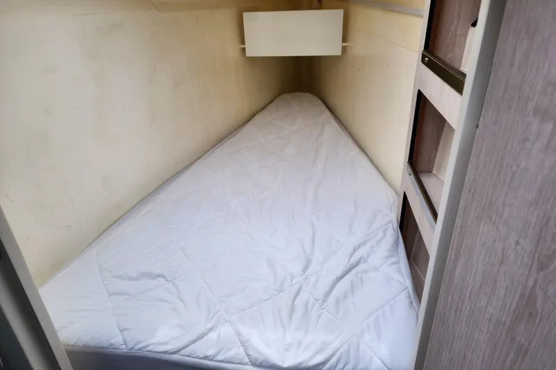 Slide: The Image of Small triangular cabin bed in a 2020 Leopard 45 yacht interior. - 98