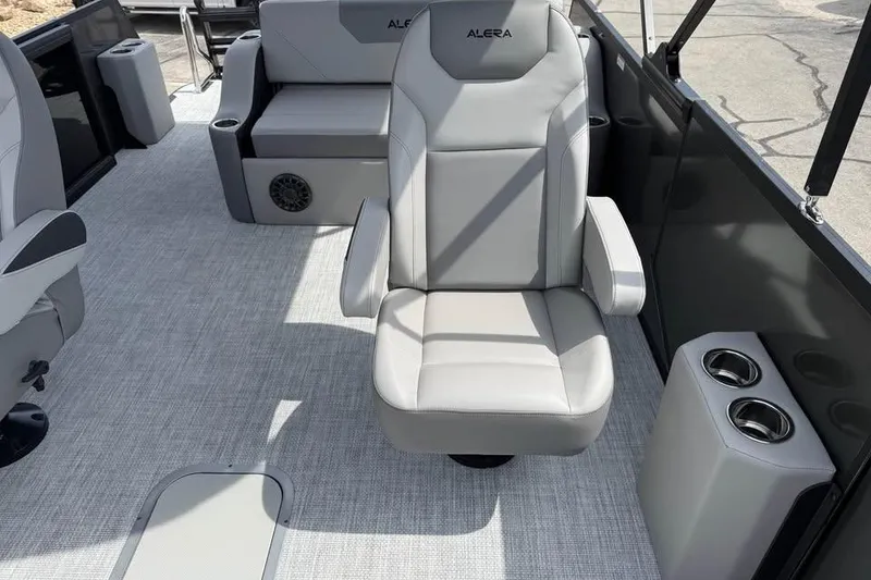 Slide: The Image of 2026 Alera 22l boat interior with gray seating and cup holders. - 13