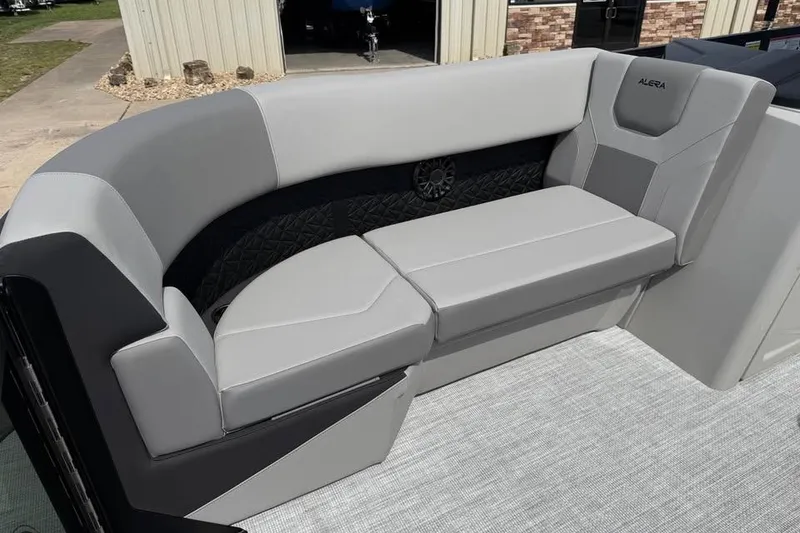 Slide: The Image of Luxurious seating in the 2026 Alera 22L boat, featuring sleek gray upholstery. - 17