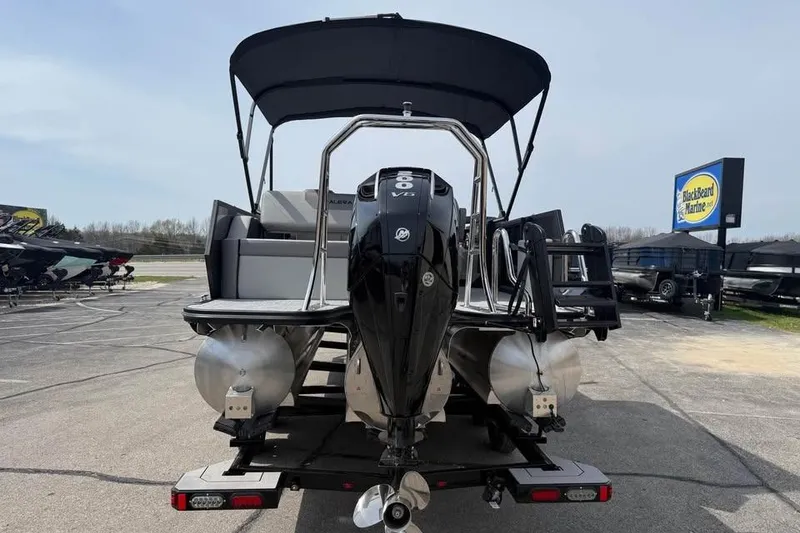 Slide: The Image of Alera 22l 2026 pontoon boat with outboard motor at Blackbeard Marine dealership. - 6