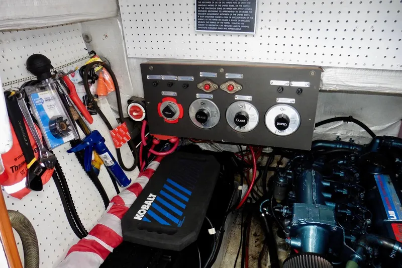 Slide: The Image of Engine room of 1988 Bayliner 3888 Motoryacht with control panel and tools. - 18