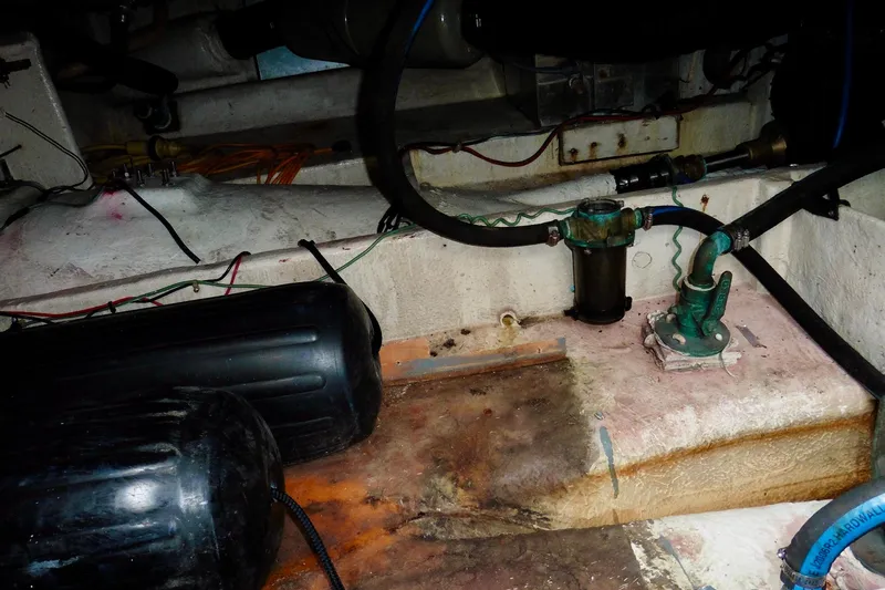 Slide: The Image of Engine room of 1988 Bayliner 3888 Motoryacht showing mechanical components and wiring. - 23