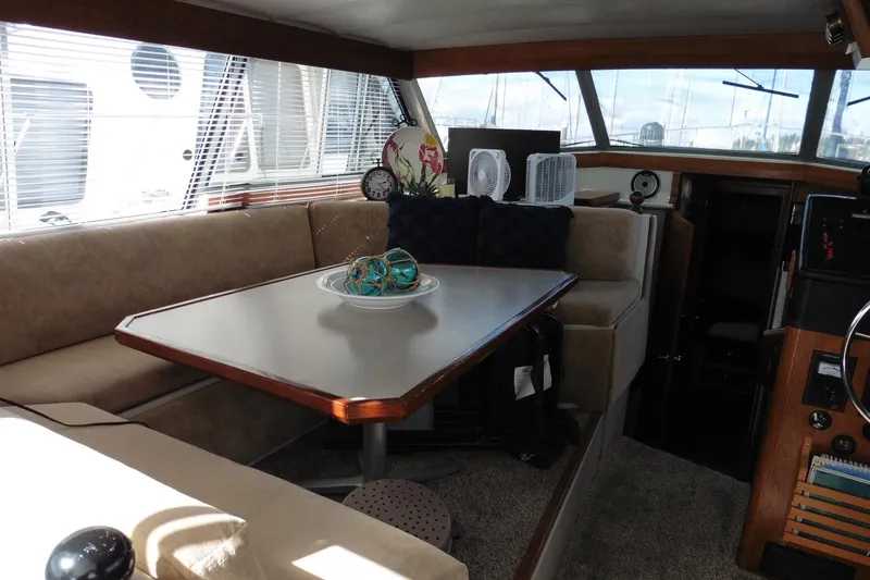 Slide: The Image of Interior of 1988 Bayliner 3888 Motoryacht with dining area and nautical decor. - 28