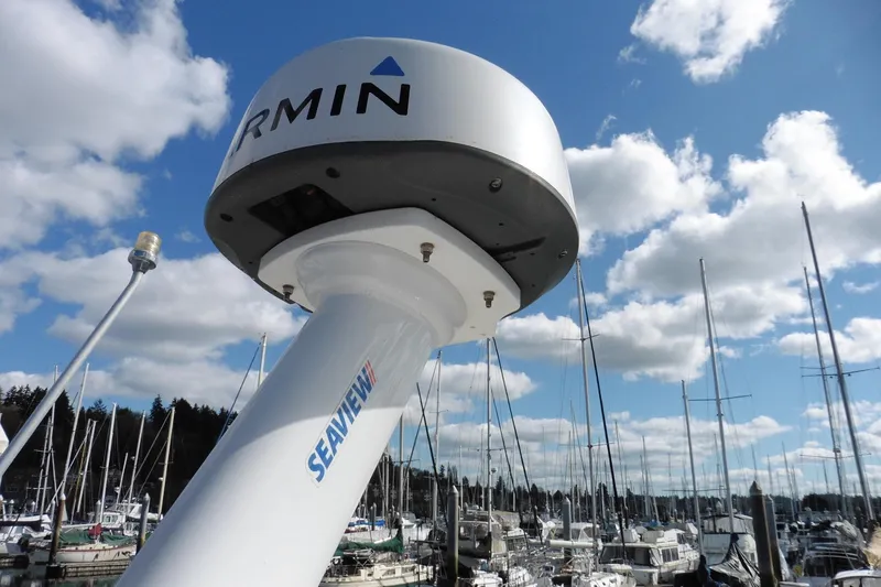 Slide: The Image of Radar equipment on a 1988 Bayliner 3888 Motoryacht, with marina and cloudy sky background. - 39