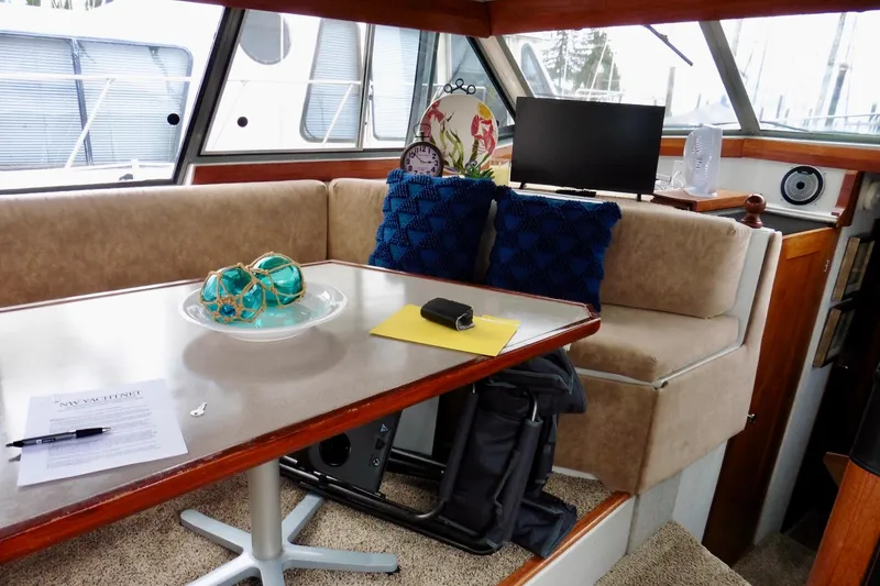 Slide: The Image of 1988 Bayliner 3888 Motoryacht interior with cozy seating and nautical decor. - 7