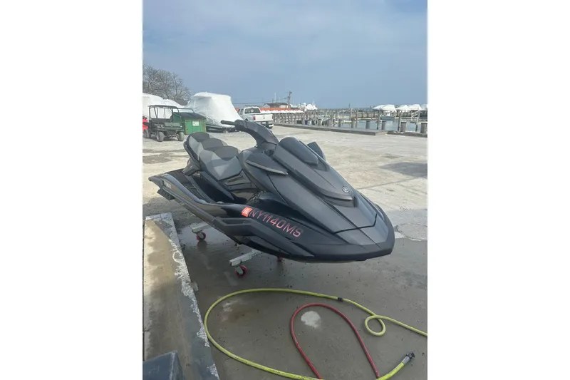 Slide: The Image of 2021 Yamaha WaveRunner FX Cruiser SVHO parked near a marina, ready for adventure. - 2