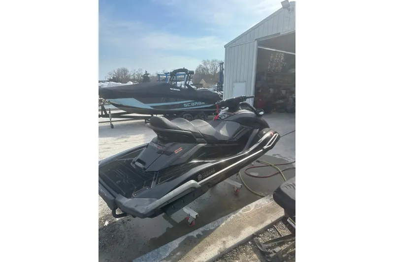 Slide: The Image of 2021 Yamaha WaveRunner FX Cruiser SVHO parked outside a garage on a sunny day. - 5