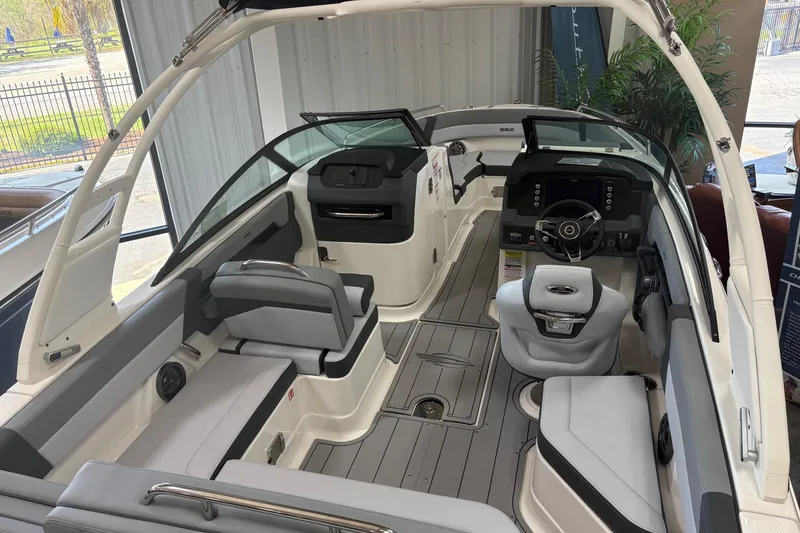Slide: The Image of 2026 Chaparral SSX 4 boat interior with modern seating and sleek dashboard design. - 3