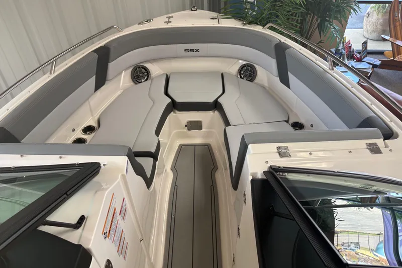 Slide: The Image of 2026 Chaparral SSX 4 boat interior with gray seating and cup holders. - 5