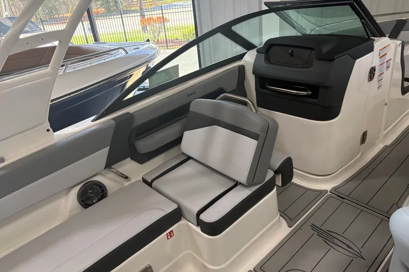 Slide: The Image of 2026 Chaparral SSX 4 boat interior with sleek seating and modern design. - 7