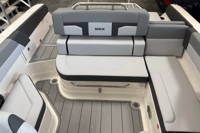 Slide: The Image of 2026 Chaparral SSX 4 boat interior with sleek gray and white seating design. - 9