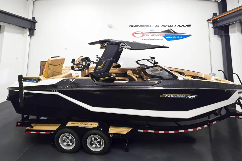 The Image of 2026 Nautique Super Air Nautique G25 Paragon boat in showroom, side view. - 1