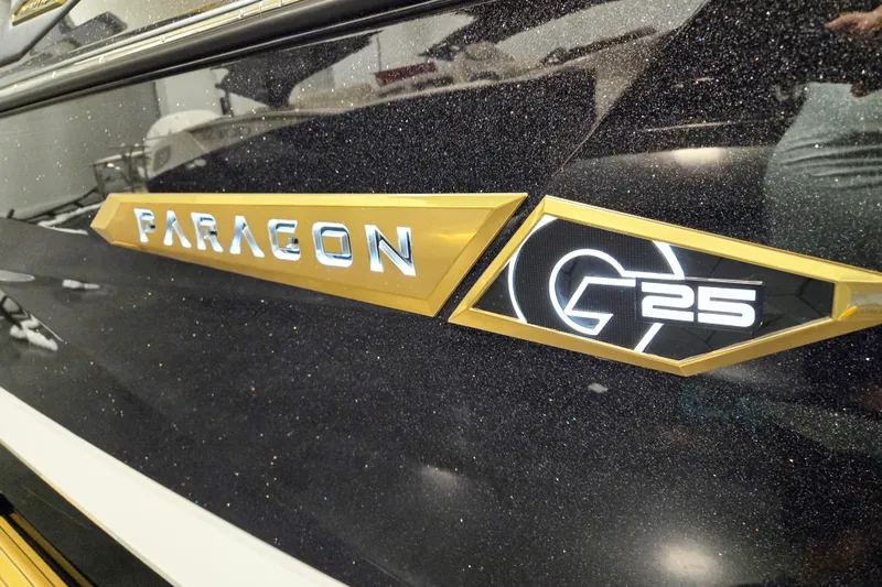 Slide: The Image of 2026 Nautique Super Air Nautique G25 Paragon logo on sleek black surface. - 15
