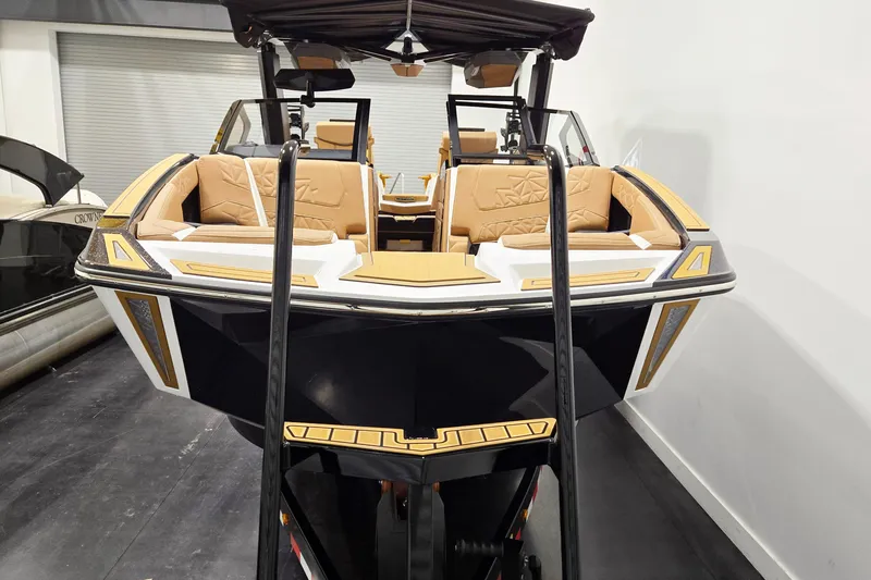 Slide: The Image of 2026 Nautique Super Air Nautique G25 Paragon boat with luxurious tan seating and sleek design. - 4