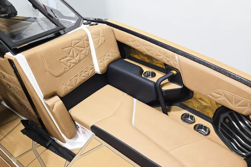 Slide: The Image of Luxurious interior of 2026 Nautique Super Air Nautique G25 Paragon boat with tan upholstery. - 7