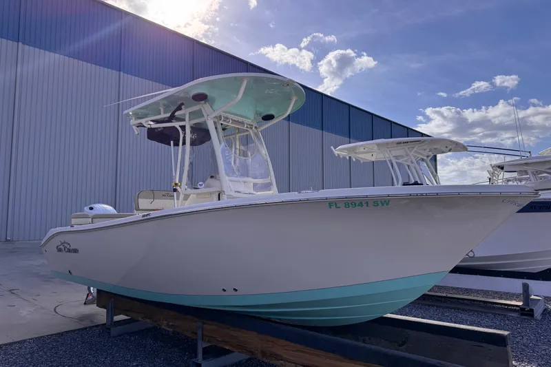 The Image of 2021 Sea Chaser 22 HFC boat docked outdoors under a partly cloudy sky. - 1