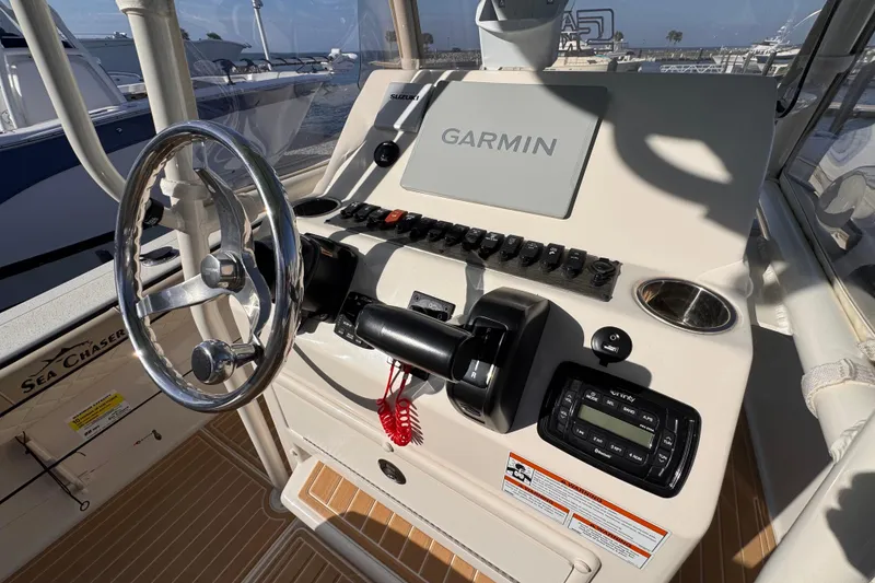 Slide: The Image of 2021 Sea Chaser 22 HFC boat dashboard with Garmin navigation system and controls. - 10