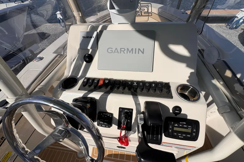 Slide: The Image of 2021 Sea Chaser 22 HFC boat dashboard with Garmin navigation system and controls. - 11