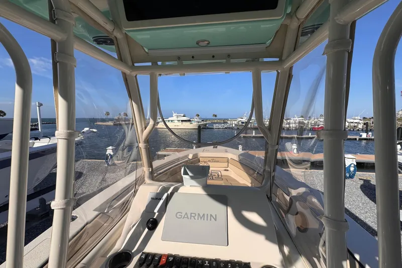 Slide: The Image of Interior view of 2021 Sea Chaser 22 HFC boat with Garmin navigation system at marina. - 12