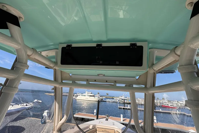 Slide: The Image of 2021 Sea Chaser 22 HFC boat interior with marina view in background. - 13