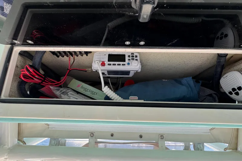 Slide: The Image of Storage compartment of 2021 Sea Chaser 22 HFC boat with electronics and accessories. - 14