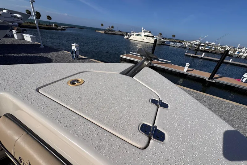 Slide: The Image of 2021 Sea Chaser 22 HFC boat at marina with clear blue sky and water. - 17