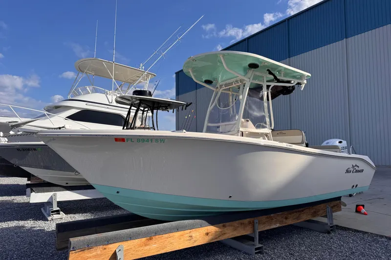 Slide: The Image of 2021 Sea Chaser 22 HFC boat on display in a marina setting. - 5