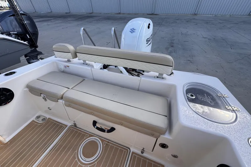 Slide: The Image of 2021 Sea Chaser 22 HFC boat interior with seating and Suzuki engine. - 6