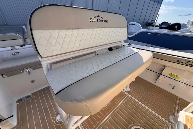 Slide: The Image of 2021 Sea Chaser 22 HFC boat interior with cushioned seating and elegant design. - 9
