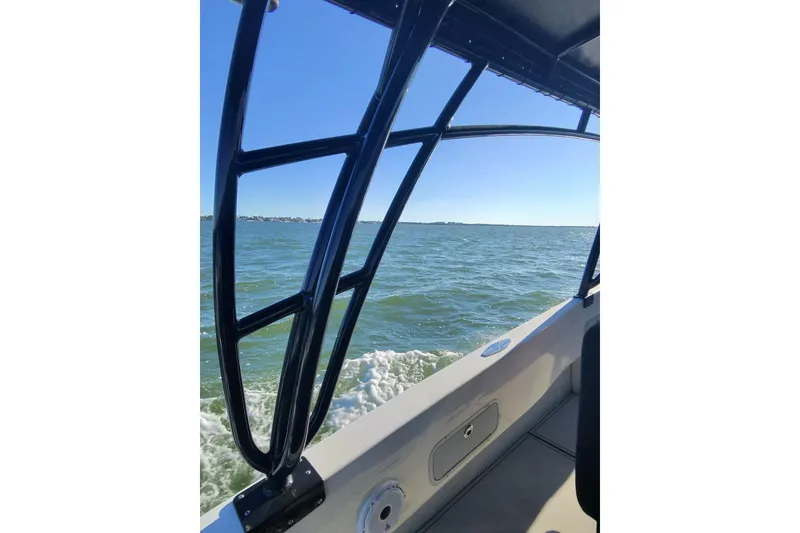 Slide: The Image of 2009 Nor-Tech 4400 Roadster cruising on open water under clear blue skies. - 13