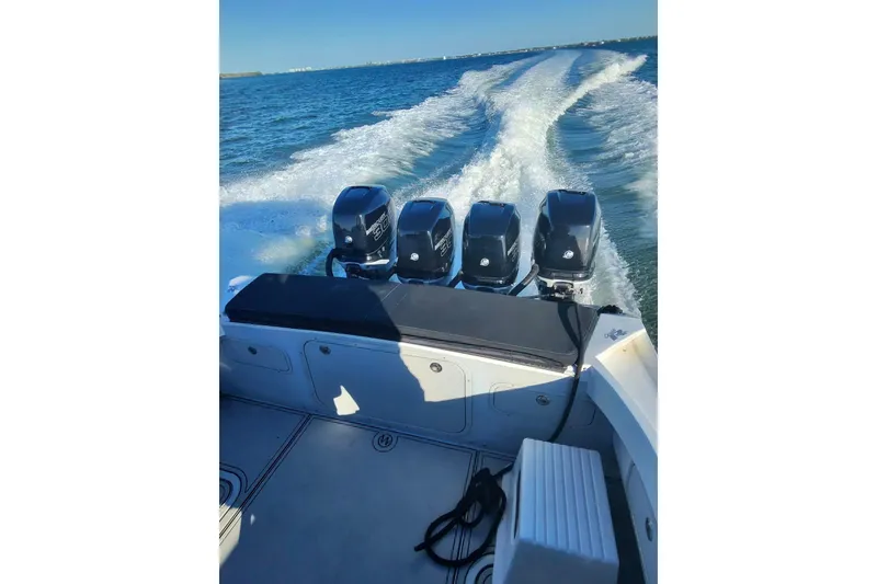 Slide: The Image of 2009 Nor-Tech 4400 Roadster with four powerful outboard engines cruising on open water. - 15