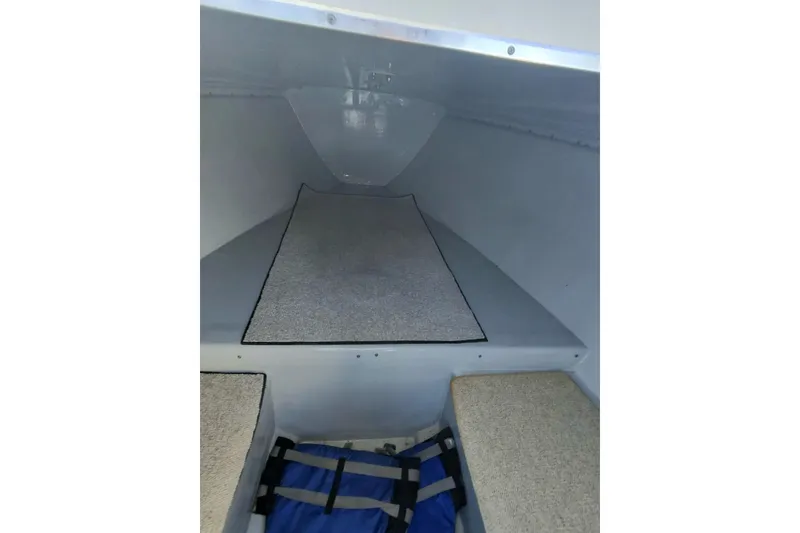 Slide: The Image of 2009 Nor-Tech 4400 Roadster interior cabin with carpeted flooring and seating. - 17