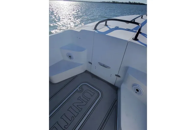Slide: The Image of 2009 Nor-Tech 4400 Roadster boat deck with ocean view and sleek design. - 19