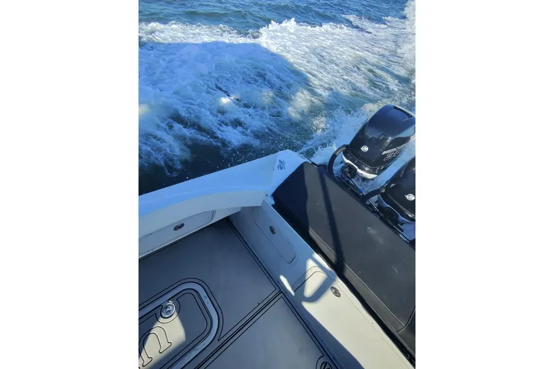 Slide: The Image of 2009 Nor-Tech 4400 Roadster boat with dual engines cruising on water. - 22