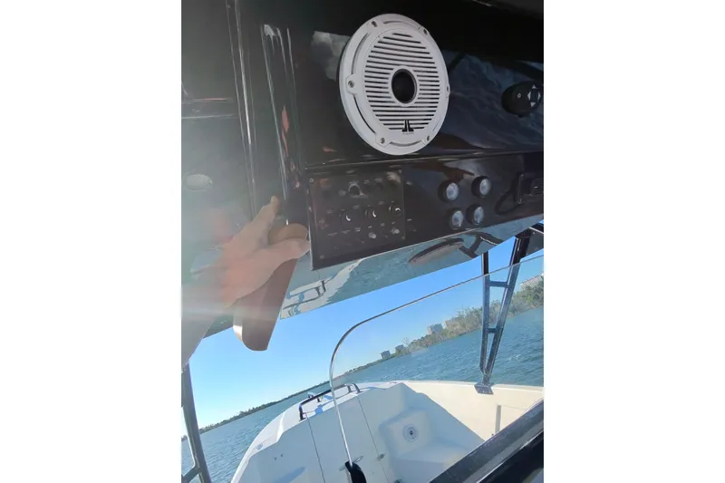 Slide: The Image of 2009 Nor-Tech 4400 Roadster dashboard with speaker, on a sunny day at sea. - 24