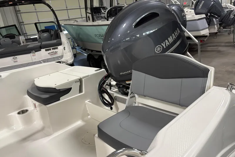 Slide: The Image of 2026 Robalo R160 Center Console boat with Yamaha engine in showroom. - 4