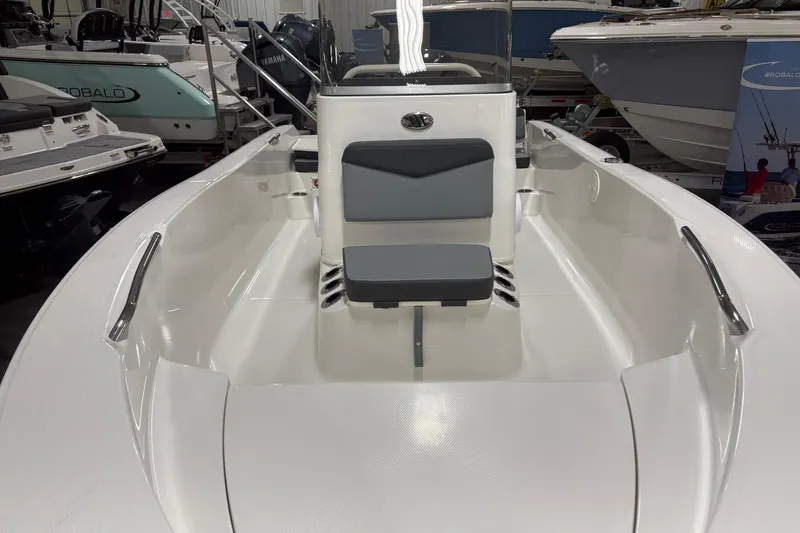 Slide: The Image of 2026 Robalo R160 Center Console boat interior with seating and steering console. - 5