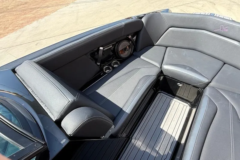 Slide: The Image of 2023 MasterCraft XStar S Piranha interior with sleek seating and modern design. - 10