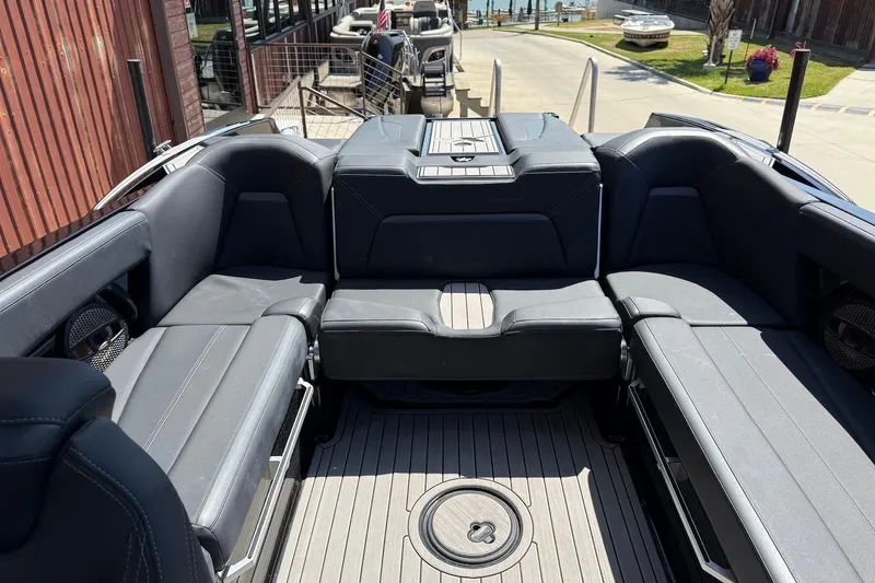 Slide: The Image of 2023 MasterCraft XStar S Piranha boat interior with sleek seating and modern design. - 15