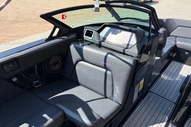 Slide: The Image of 2023 MasterCraft XStar S Piranha interior with sleek seating and modern dashboard design. - 5