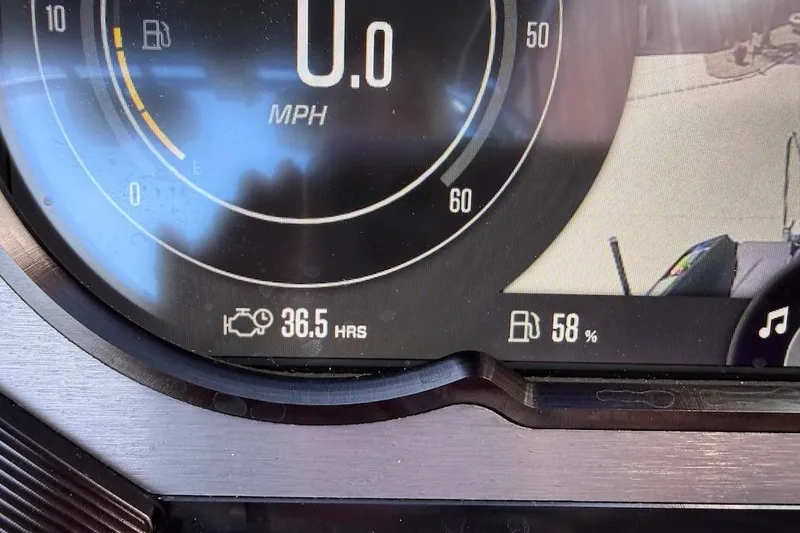 Slide: The Image of Dashboard of 2023 MasterCraft XStar S Piranha showing 0 MPH, 36.5 hours, 58% fuel. - 8