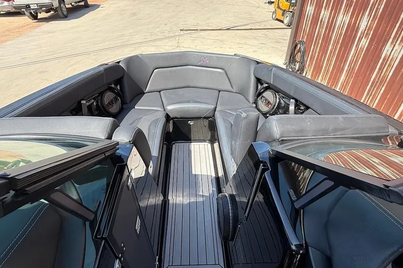 Slide: The Image of 2023 MasterCraft XStar S Piranha boat interior with sleek seating and modern design. - 9