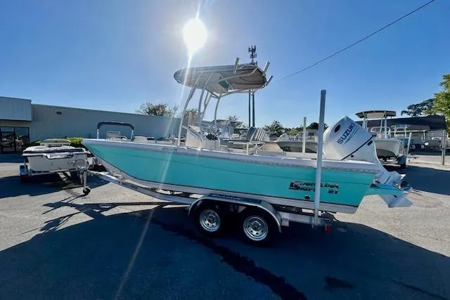 Slide: The Image of 2026 Carolina Skiff 21 Ultra Elite boat on trailer under bright sun. - 3