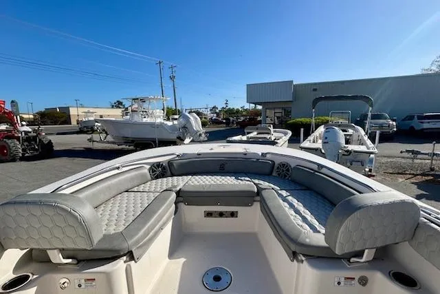 Slide: The Image of 2026 Carolina Skiff 21 Ultra Elite boat with spacious seating, displayed outdoors. - 6