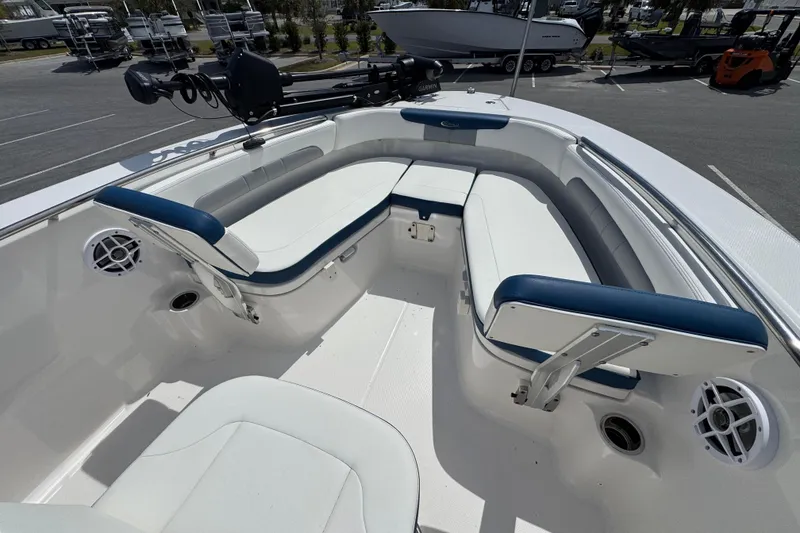 Slide: The Image of 2023 Robalo R202 Explorer boat interior with cushioned seating and modern design. - 10
