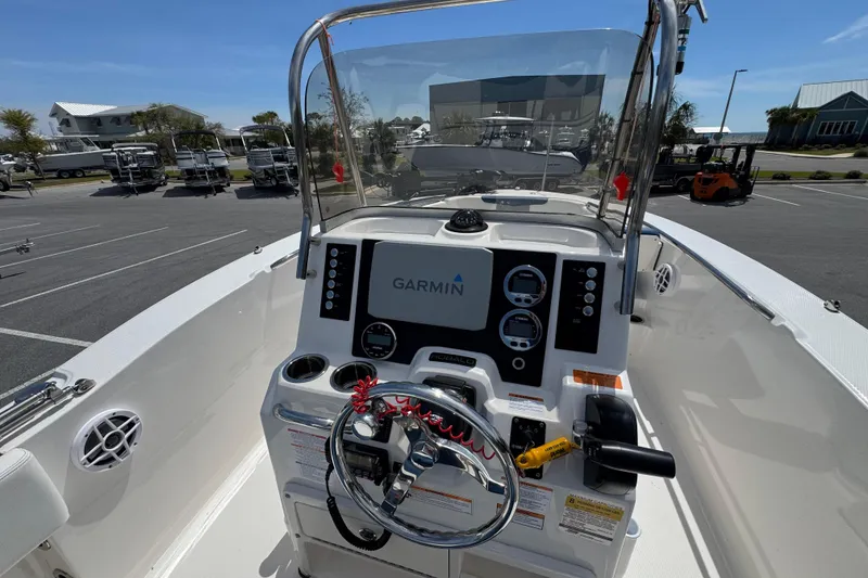 Slide: The Image of 2023 Robalo R202 Explorer boat dashboard with Garmin navigation system. - 12