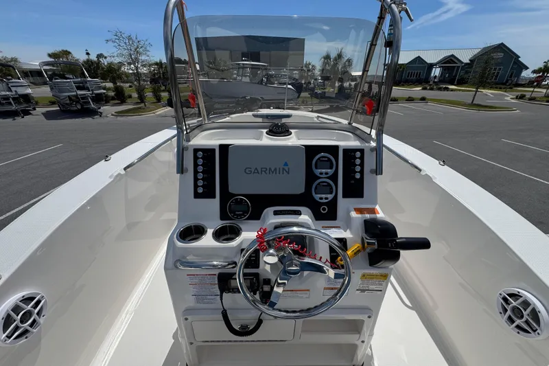 Slide: The Image of 2023 Robalo R202 Explorer boat dashboard with Garmin navigation system. - 13