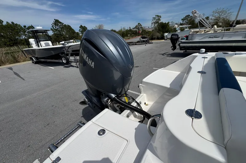 Slide: The Image of 2023 Robalo R202 Explorer with Yamaha outboard engine in parking lot. - 17